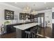 Modern kitchen with dark cabinetry, stainless steel appliances, granite countertops and a large center island at 1250 Atherton Park, Roswell, GA 30076