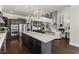 Spacious kitchen with large island, granite countertops, stainless steel appliances, and access to the living room at 1250 Atherton Park, Roswell, GA 30076