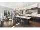 Bright kitchen features a large island with seating, pendant lighting, and modern appliances at 1250 Atherton Park, Roswell, GA 30076