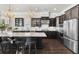 Modern kitchen boasts a large island, stainless steel appliances, and stylish light fixtures at 1250 Atherton Park, Roswell, GA 30076