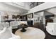 Open-concept living room with modern decor, hardwood floors, and seamless transition into the kitchen area at 1250 Atherton Park, Roswell, GA 30076