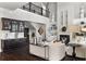 Bright living room with a bar, a fireplace, and an overlooking second-floor balcony at 1250 Atherton Park, Roswell, GA 30076