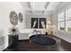 Stylish living room with coffered ceilings, sophisticated decor, and large windows that fill the space with natural light at 1250 Atherton Park, Roswell, GA 30076