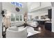 Open concept living room with high ceilings seamlessly flows into the kitchen at 1250 Atherton Park, Roswell, GA 30076