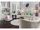 Bright living room boasting natural light, fireplace, and hardwood floors at 1250 Atherton Park, Roswell, GA 30076