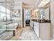 Main bathroom boasts a soaking tub, glass shower, and dual vanities at 1250 Atherton Park, Roswell, GA 30076