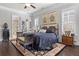Main bedroom with ensuite bathroom access, hardwood floors and shuttered windows at 1250 Atherton Park, Roswell, GA 30076