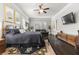 Spacious primary bedroom features dark hardwood floors, a large bed, and windows with plantation shutters at 1250 Atherton Park, Roswell, GA 30076