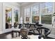 Cozy sitting area with elegant décor, a stylish table, and bright natural light coming from the windows at 1250 Atherton Park, Roswell, GA 30076