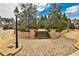 Street view showing brick path with steps leading up to a grassy area with trees and landscaping at 1250 Atherton Park, Roswell, GA 30076