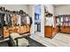 Spacious walk-in closet featuring custom storage and a stylish bench at 1250 Atherton Park, Roswell, GA 30076