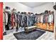Large walk-in closet with wood dresser and black rug at 1250 Atherton Park, Roswell, GA 30076