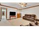 Finished basement recreation area with leather furniture and wet bar at 3781 Anneewakee Rd, Douglasville, GA 30135