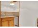 Basement bar with wet bar, mini-fridge, and wood cabinetry at 3781 Anneewakee Rd, Douglasville, GA 30135