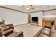 Finished basement recreation area with leather furniture and wet bar at 3781 Anneewakee Rd, Douglasville, GA 30135