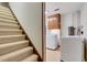Carpeted basement stairs leading to laundry area at 3781 Anneewakee Rd, Douglasville, GA 30135