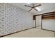 Bedroom with wood shelving and cartoon wallpaper at 3781 Anneewakee Rd, Douglasville, GA 30135