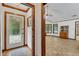 Inviting entryway with glass-paned door and view into sunroom at 3781 Anneewakee Rd, Douglasville, GA 30135