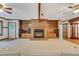Living room fireplace with brick surround and wooden mantel at 3781 Anneewakee Rd, Douglasville, GA 30135