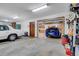 Two-car garage with a car lift and extra storage at 3781 Anneewakee Rd, Douglasville, GA 30135