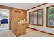 View of garage from sunroom with brick half-wall at 3781 Anneewakee Rd, Douglasville, GA 30135