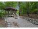 Screened gazebo with wooden flooring and white chairs at 3781 Anneewakee Rd, Douglasville, GA 30135