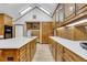 Bright kitchen featuring an abundance of wooden cabinetry and an expansive island at 3781 Anneewakee Rd, Douglasville, GA 30135