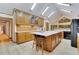 Large kitchen with island, quartz countertops, and wood cabinets at 3781 Anneewakee Rd, Douglasville, GA 30135