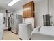 Laundry room with washer, dryer and extra storage at 3781 Anneewakee Rd, Douglasville, GA 30135