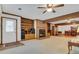 Bright living room featuring a brick fireplace and built-in shelving at 3781 Anneewakee Rd, Douglasville, GA 30135