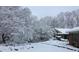 Snow-covered yard and home with mature trees at 3781 Anneewakee Rd, Douglasville, GA 30135