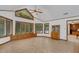 Sunroom with tile flooring, built-in window seat, and abundant natural light at 3781 Anneewakee Rd, Douglasville, GA 30135