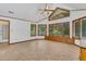 Sunroom with tile flooring, built-in window seat, and abundant natural light at 3781 Anneewakee Rd, Douglasville, GA 30135