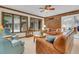 Sunroom with brick wall, access to garage, and seating area at 3781 Anneewakee Rd, Douglasville, GA 30135