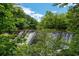 Serene waterfall view with lush greenery at 3781 Anneewakee Rd, Douglasville, GA 30135