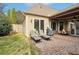 Enjoy this patio with seating and a grill at 312 Gray Shingle Ln, Woodstock, GA 30189