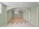 Finished basement with archway and neutral walls at 3343 Charlemagne Dr, Decatur, GA 30034