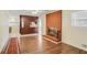 Open concept living area with fireplace and built-in shelving at 3343 Charlemagne Dr, Decatur, GA 30034