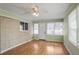 Light-filled sunroom with brick and wood flooring at 3343 Charlemagne Dr, Decatur, GA 30034