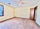 Spacious bedroom with carpet flooring and ceiling fan at 5615 Pennybrook Ct, Stone Mountain, GA 30087