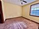 Bright bedroom featuring carpet and a window at 5615 Pennybrook Ct, Stone Mountain, GA 30087