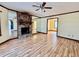 Spacious living room with hardwood floors, fireplace and large windows at 5615 Pennybrook Ct, Stone Mountain, GA 30087