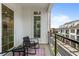 Relaxing balcony with two chairs and a rug, overlooking the neighborhood at 137 Devore Rd, Alpharetta, GA 30009