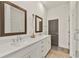 Modern bathroom with double vanity, large mirrors and walk-in shower at 137 Devore Rd, Alpharetta, GA 30009
