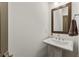Small bathroom with pedestal sink, mirror and modern fixtures at 137 Devore Rd, Alpharetta, GA 30009
