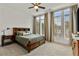 Bright bedroom with large windows, ceiling fan, and wood flooring at 137 Devore Rd, Alpharetta, GA 30009