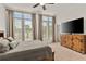 Spacious bedroom with large windows, ceiling fan, and ample closet space at 137 Devore Rd, Alpharetta, GA 30009
