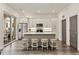 Modern kitchen with white cabinets, stainless steel appliances, and access to a balcony at 137 Devore Rd, Alpharetta, GA 30009