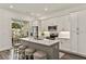 Modern kitchen with white cabinets, island, and stainless steel appliances at 137 Devore Rd, Alpharetta, GA 30009