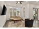 Living room with hardwood floors, comfortable seating, and access to a balcony at 137 Devore Rd, Alpharetta, GA 30009